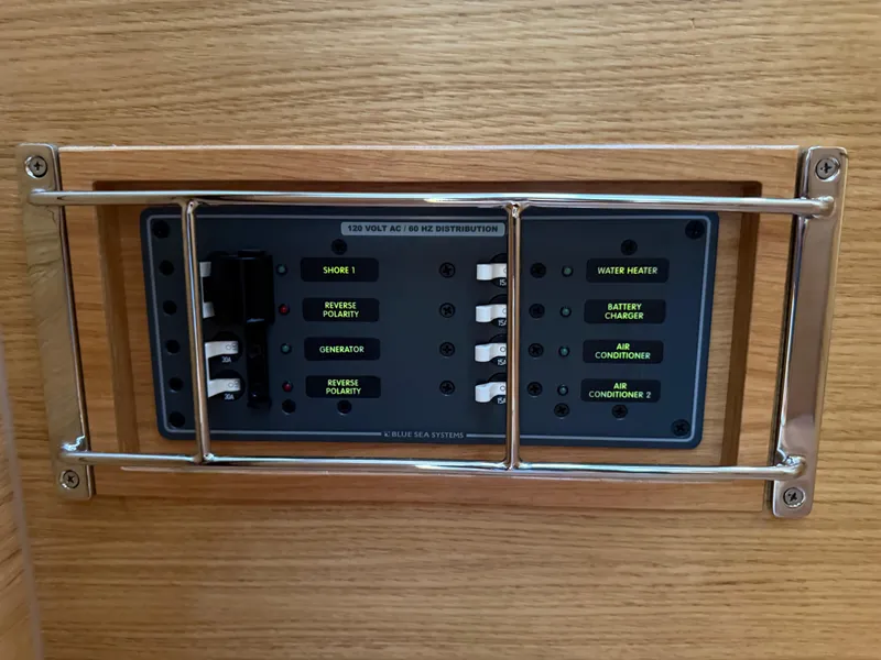 Slide: The Image of Electrical control panel on 2019 X-Yachts X4⁶, featuring switches and labels. - 24