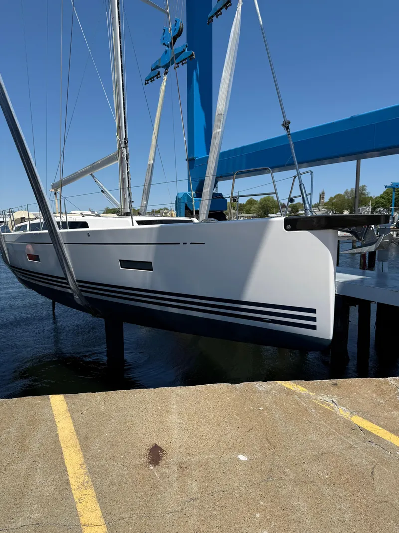Slide: The Image of 2019 X-Yachts X4⁶ sailboat in dry dock, showcasing sleek design and modern features. - 4