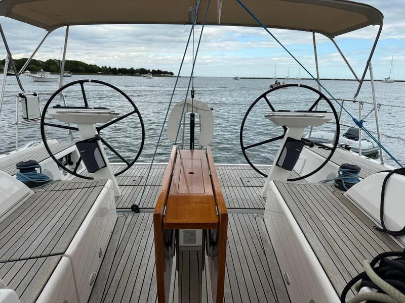 Slide: The Image of Sailing yacht X-Yachts X4⁶ cockpit with dual steering wheels, 2019 model, on calm waters. - 6