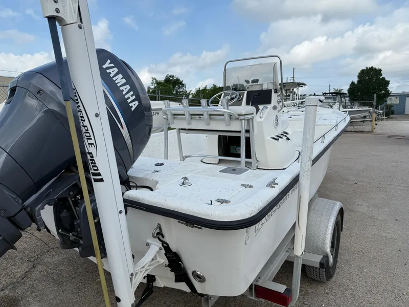 Slide: The Image of 2010 Blazer Bay 2170 boat with Yamaha engine on trailer, parked outdoors. - 4