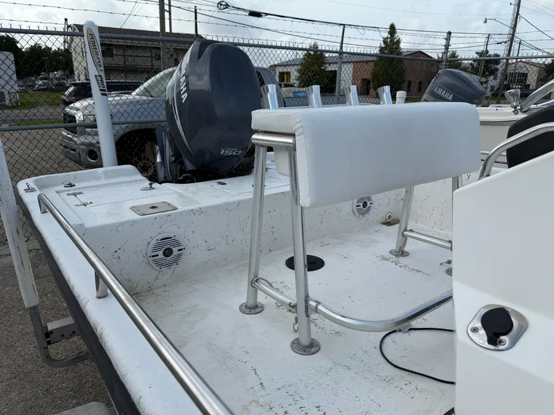 Slide: The Image of 2010 Blazer Bay 2170 boat with Yamaha outboard motor, docked in a fenced area. - 7