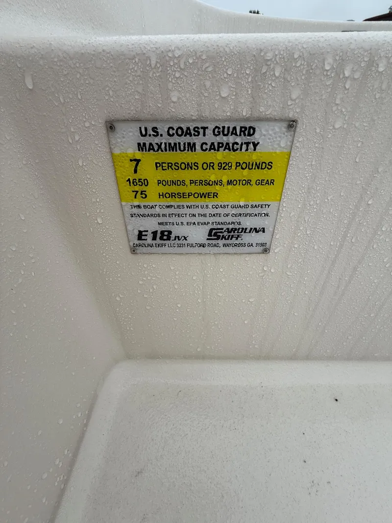 Slide: The Image of 2025 Carolina Skiff E18 JVX CC capacity label, 7 persons or 929 pounds, 75 horsepower. - 7
