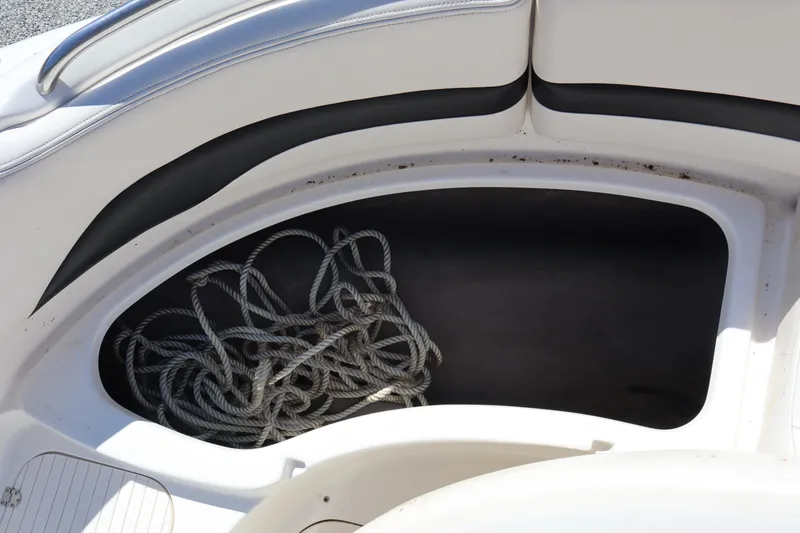 Slide: The Image of Storage compartment with rope in 2000 Chaparral Sunesta 232 boat. - 13