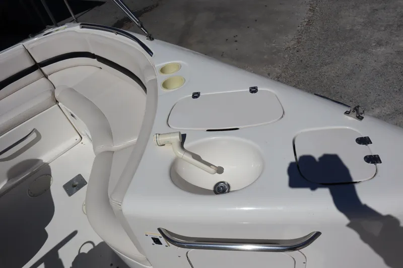 Slide: The Image of 2000 Chaparral Sunesta 232 boat interior with seating and sink. - 16