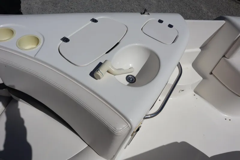 Slide: The Image of 2000 Chaparral Sunesta 232 boat interior with sink and storage compartments. - 17