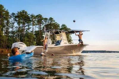 The Image of 2026 Tidewater 282 CC Adventure boat with people enjoying water activities. - 1