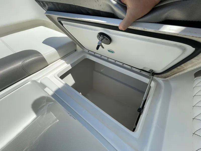 Slide: The Image of Open storage compartment on 2022 World Cat 255 DC boat. - 19