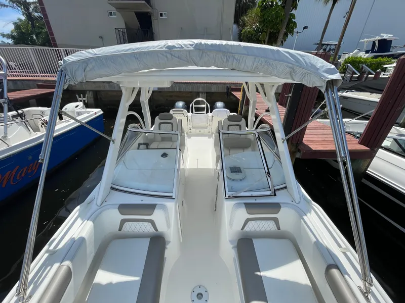Slide: The Image of 2022 World Cat 255 DC boat with canopy, docked at marina. - 22