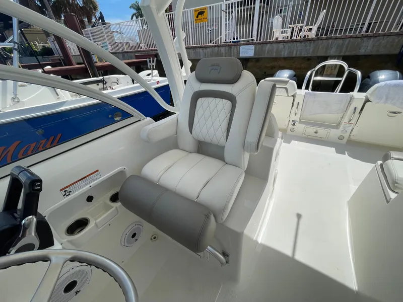 Slide: The Image of 2022 World Cat 255 DC boat interior with white and gray seating. - 26