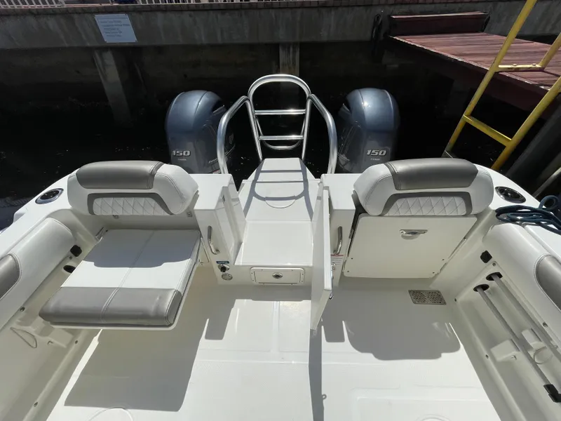 Slide: The Image of 2022 World Cat 255 DC boat interior with seating and twin engines. - 36