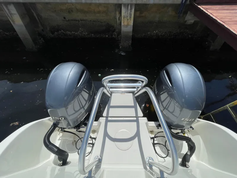 Slide: The Image of 2022 World Cat 255 DC boat with dual outboard motors at dock. - 37
