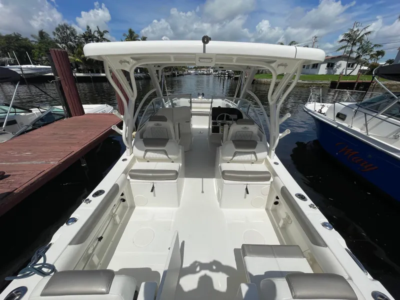 Slide: The Image of 2022 World Cat 255 DC boat docked, featuring spacious seating and sleek design. - 39