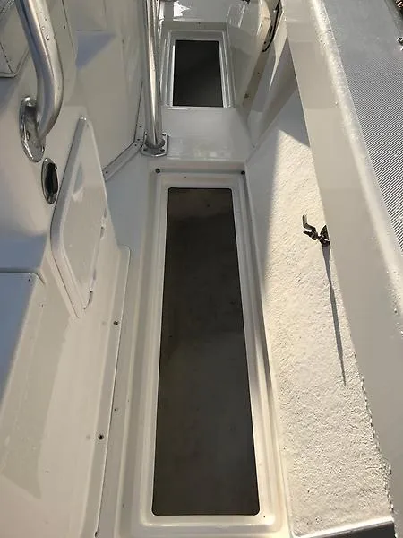 Slide: The Image of 2014 Ocean Master 29 CC boat deck with storage compartments. - 10