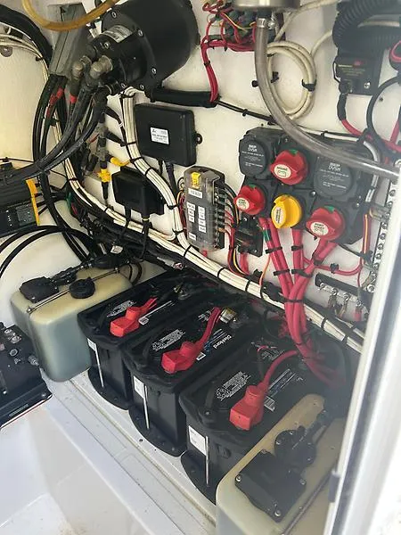 Slide: The Image of Electrical system of a 2014 Ocean Master 29 CC boat, featuring batteries and wiring. - 14