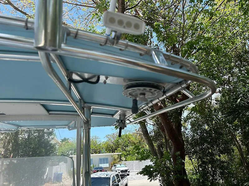 Slide: The Image of 2014 Ocean Master 29 CC boat canopy with stainless steel frame and mounted equipment. - 15