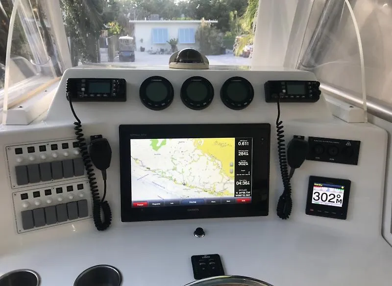 Slide: The Image of 2014 Ocean Master 29 CC boat dashboard with navigation and communication equipment. - 7