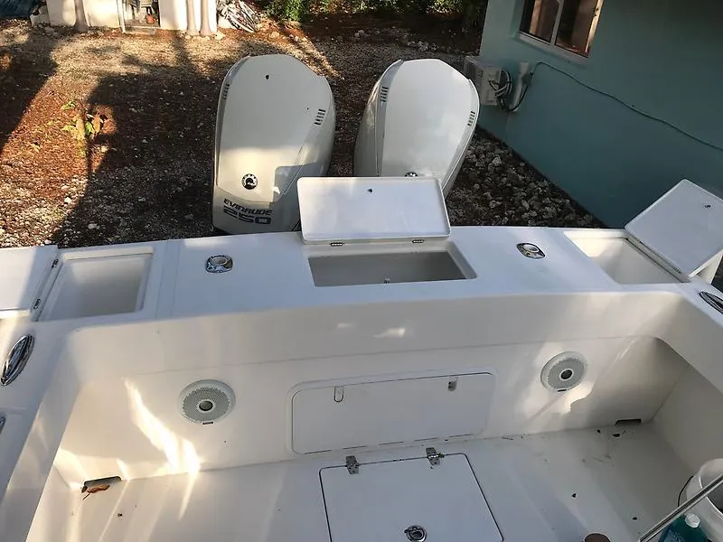 Slide: The Image of 2014 Ocean Master 29 CC boat deck with dual outboard motors. - 9