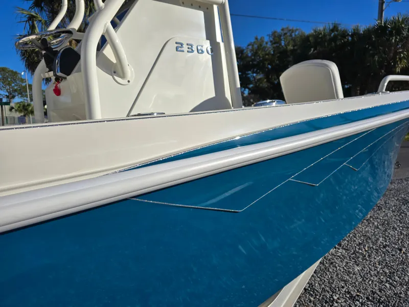 Slide: The Image of 2025 Ranger 2360 Bay boat with sleek blue and white design. - 5