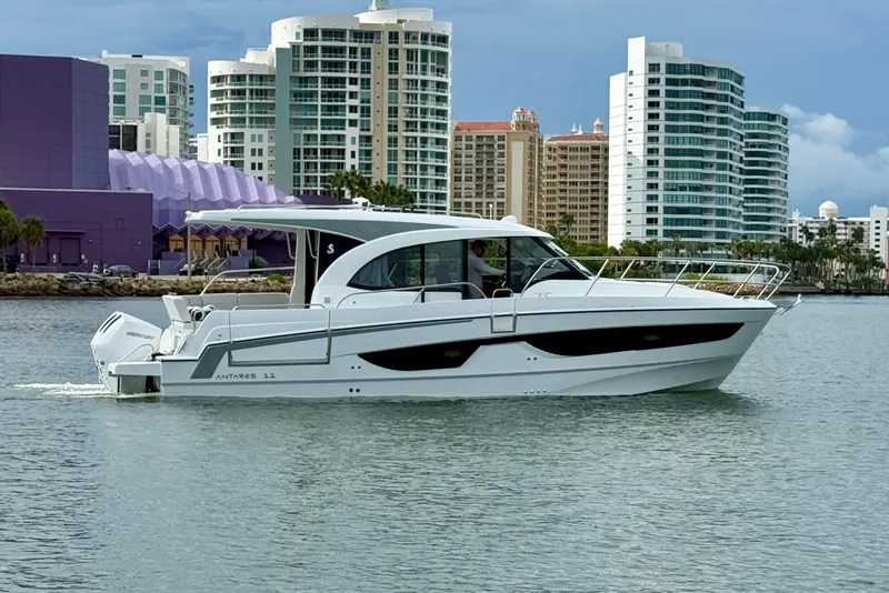 The Image of 2026 Beneteau Antares 11 cruising near modern city skyline. - 0