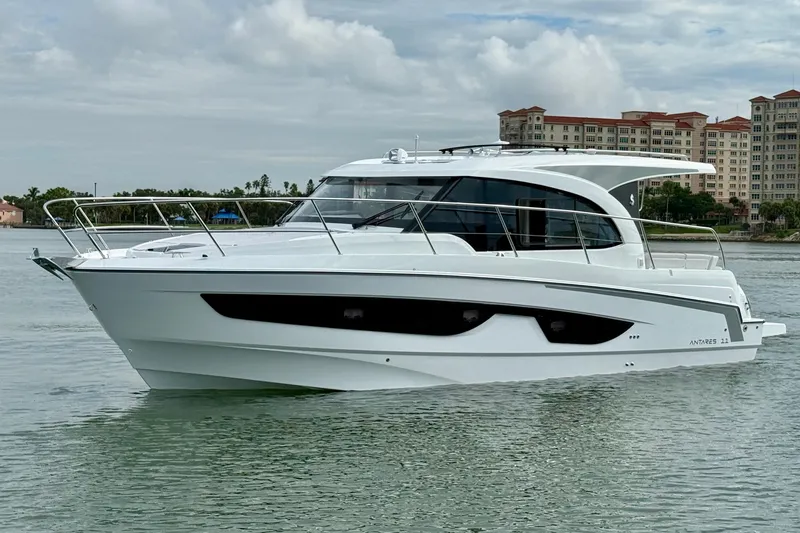Slide: The Image of 2026 Beneteau Antares 11 boat on calm water, modern design, cityscape background. - 3