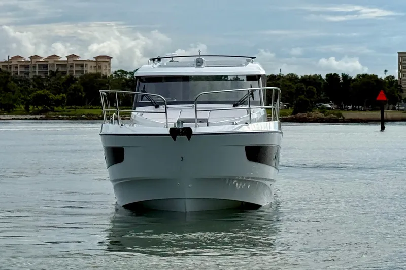Slide: The Image of 2026 Beneteau Antares 11 yacht on calm water, front view. - 5