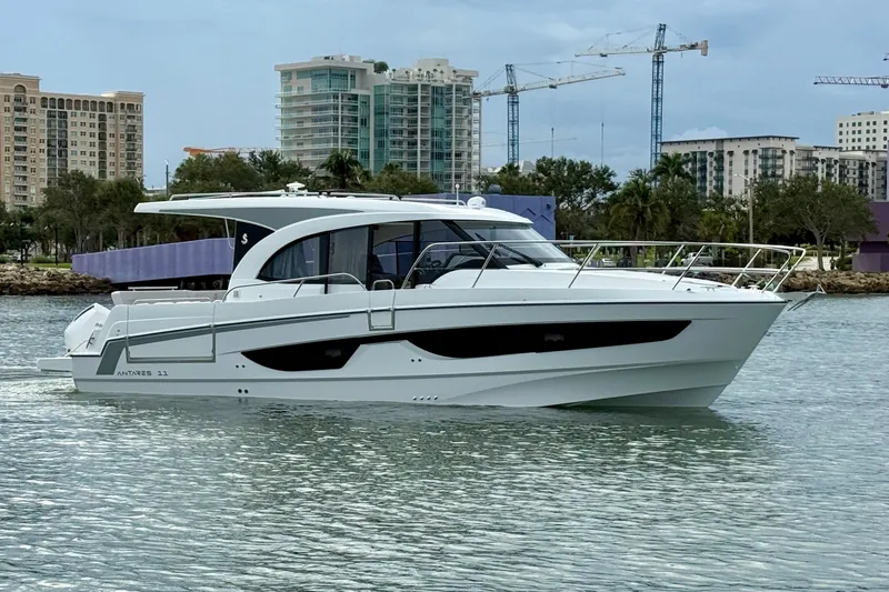 Slide: The Image of 2026 Beneteau Antares 11 yacht cruising in urban waterfront setting. - 6