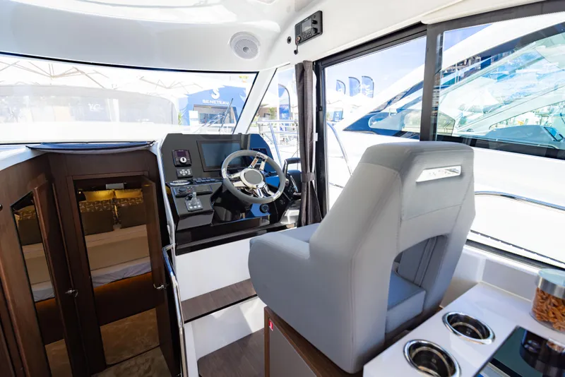 Slide: The Image of Interior of 2026 Beneteau Antares 11, featuring helm station and captain's chair. - 9