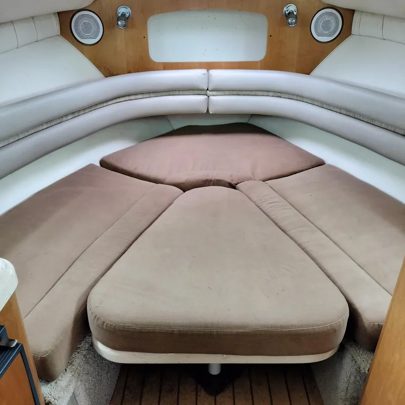 Slide: The Image of Interior cabin of 2001 Chris-Craft 26 Constellation boat with cushioned seating. - 15