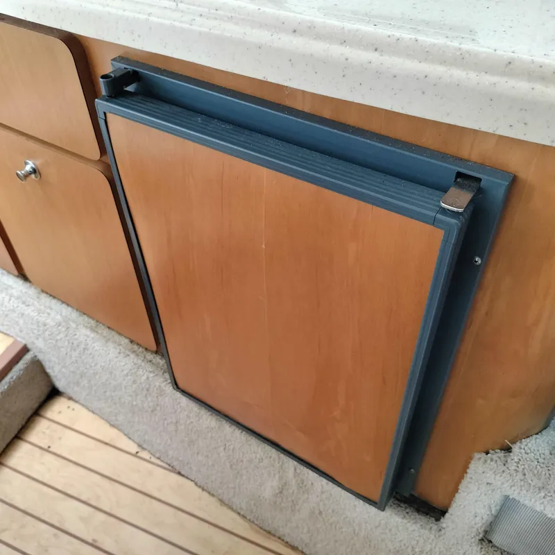 Slide: The Image of Wooden cabinetry and fridge in 2001 Chris-Craft 26 Constellation boat interior. - 19