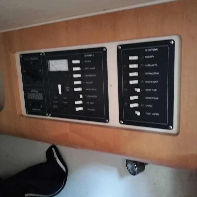 Slide: The Image of Electrical control panel on 2001 Chris-Craft 26 Constellation boat interior. - 23