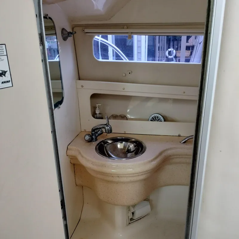 Slide: The Image of 2001 Chris-Craft 26 Constellation boat bathroom with sink and mirror. - 24