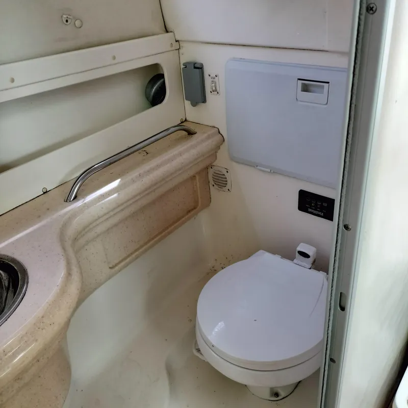 Slide: The Image of 2001 Chris-Craft 26 Constellation boat bathroom interior with toilet and sink. - 25
