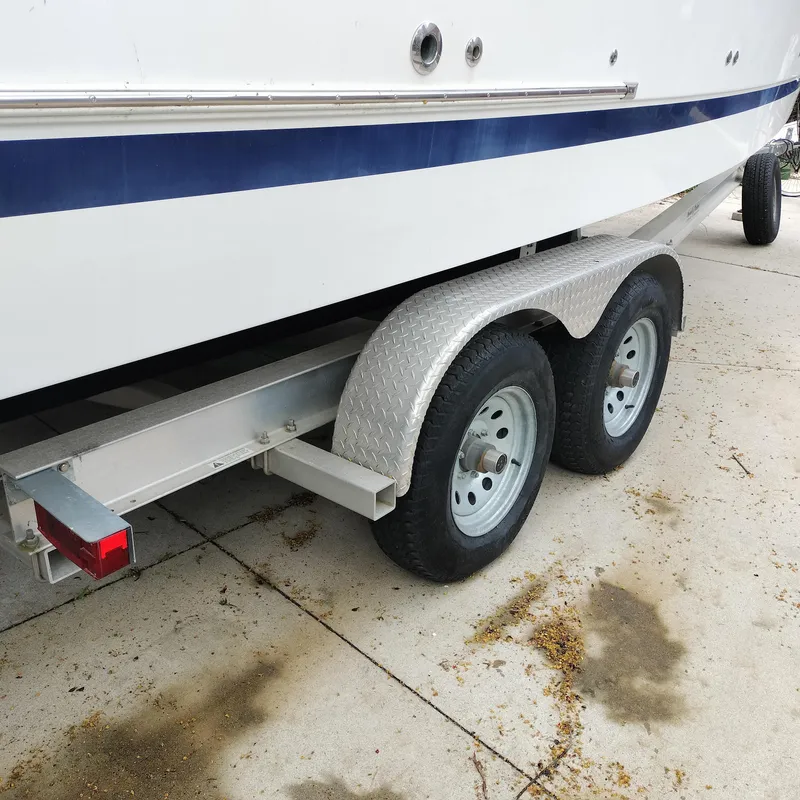 Slide: The Image of 2001 Chris-Craft 26 Constellation boat on a dual-axle trailer. - 5