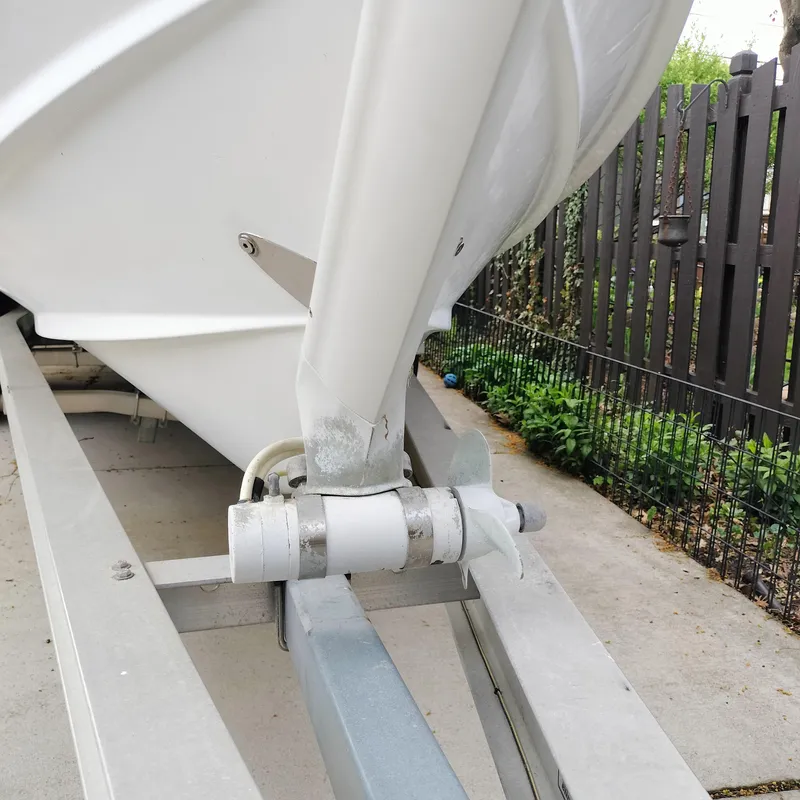 Slide: The Image of 2001 Chris-Craft 26 Constellation boat on trailer, close-up view of hull and support. - 6