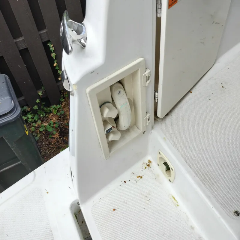 Slide: The Image of 2001 Chris-Craft 26 Constellation boat interior detail with storage compartment and deck. - 8