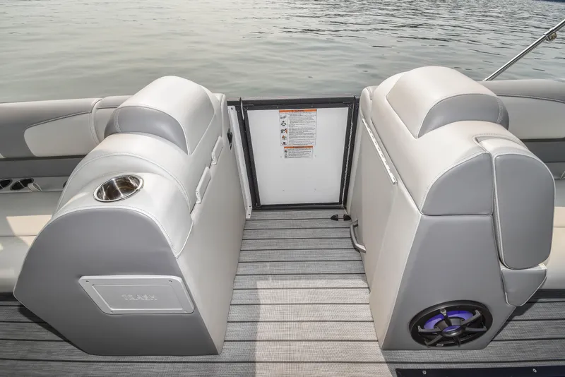 Slide: The Image of 2022 Montara MT 2.0 25 CW boat interior with gray seating and cup holder. - 16