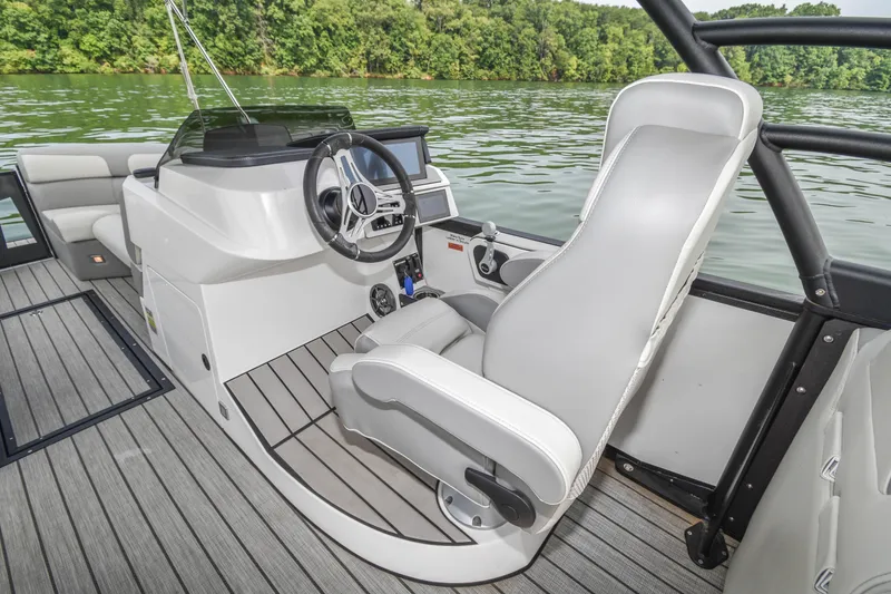 Slide: The Image of 2022 Montara MT 2.0 25 CW boat interior with steering wheel and captain's chair. - 18