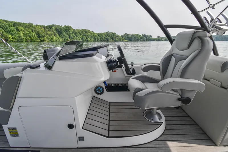 Slide: The Image of 2022 Montara MT 2.0 25 CW boat interior with sleek helm and comfortable captain's chair. - 20