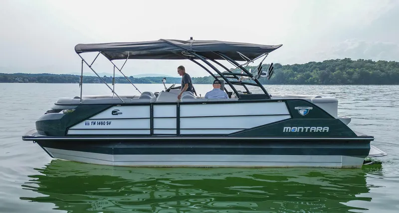 Slide: The Image of 2022 Montara MT 2.0 25 CW boat cruising on a serene lake. - 5