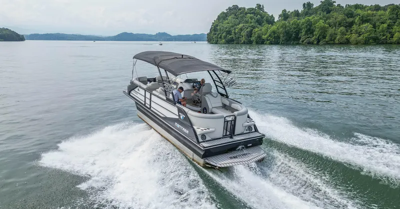Slide: The Image of 2022 Montara MT 2.0 25 CW cruising on a scenic lake with lush greenery. - 6