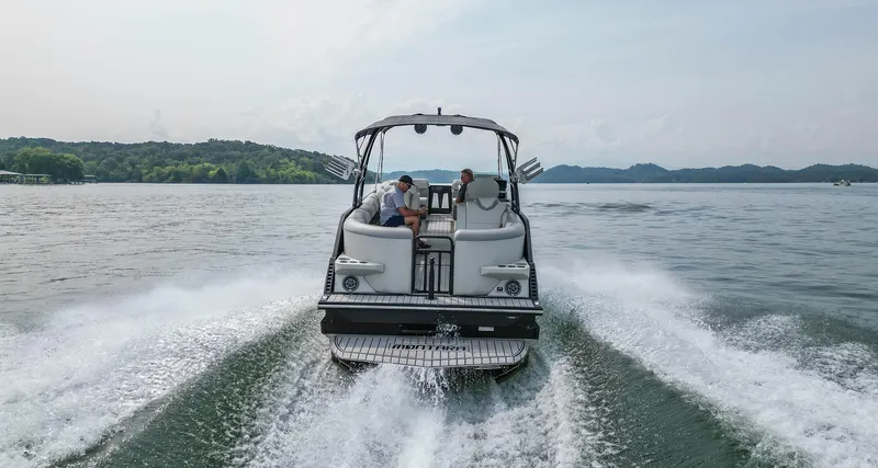 Slide: The Image of 2022 Montara MT 2.0 25 CW boat cruising on a scenic lake. - 8