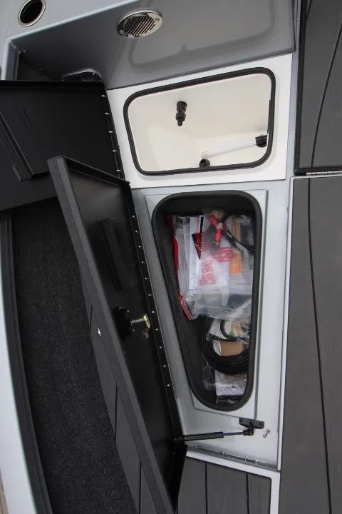 Slide: The Image of 2025 Vexus ADX 200 storage compartments with organized gear and equipment. - 12