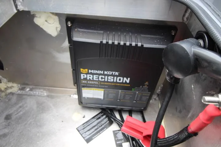 Slide: The Image of Minn Kota Precision charger in 2025 Vexus ADX 200 boat compartment. - 13