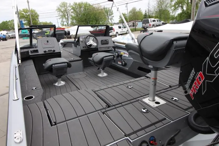 Slide: The Image of 2025 Vexus ADX 200 boat interior with seating and controls, featuring a Mercury Pro XS engine. - 4