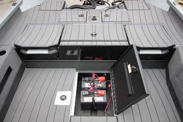 Slide: The Image of 2025 Vexus ADX 200 boat interior with open storage compartments and visible battery setup. - 8