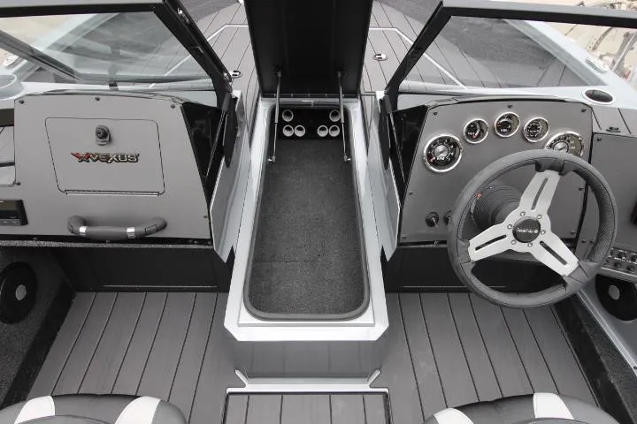 Slide: The Image of 2025 Vexus ADX 200 boat interior with steering wheel and dashboard controls. - 9