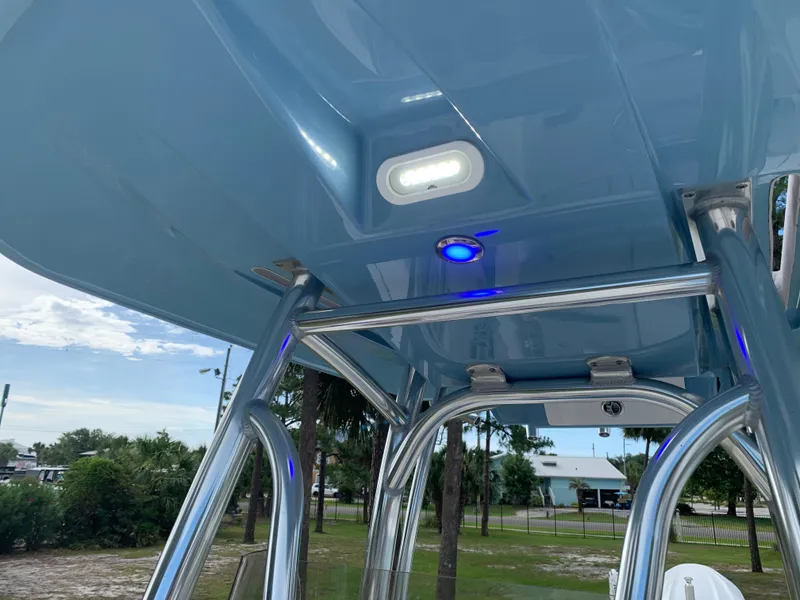 Slide: The Image of 2024 Pathfinder 2400 TRS boat with blue T-top and integrated lighting. - 15