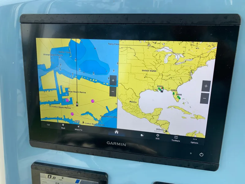 Slide: The Image of Garmin navigation display on 2024 Pathfinder 2400 TRS boat, showing detailed marine maps. - 20