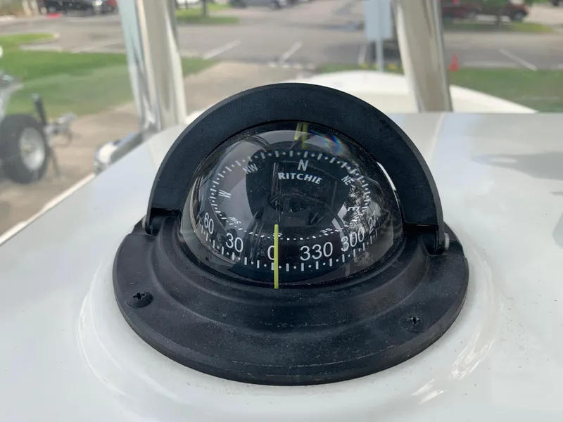 Slide: The Image of Compass on 2024 Pathfinder 2400 TRS boat dashboard, showing navigation directions. - 38
