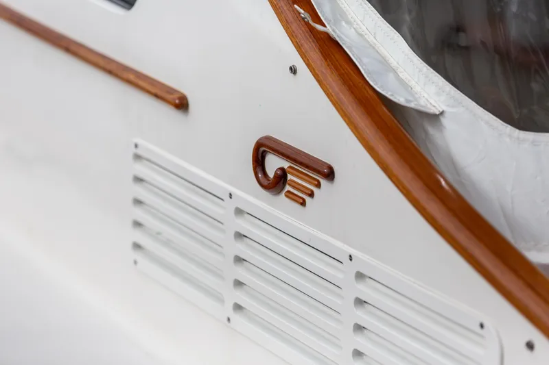 Slide: The Image of 2023 Hinckley Picnic Boat 34 S, featuring elegant wood accents and sleek design details. - 4